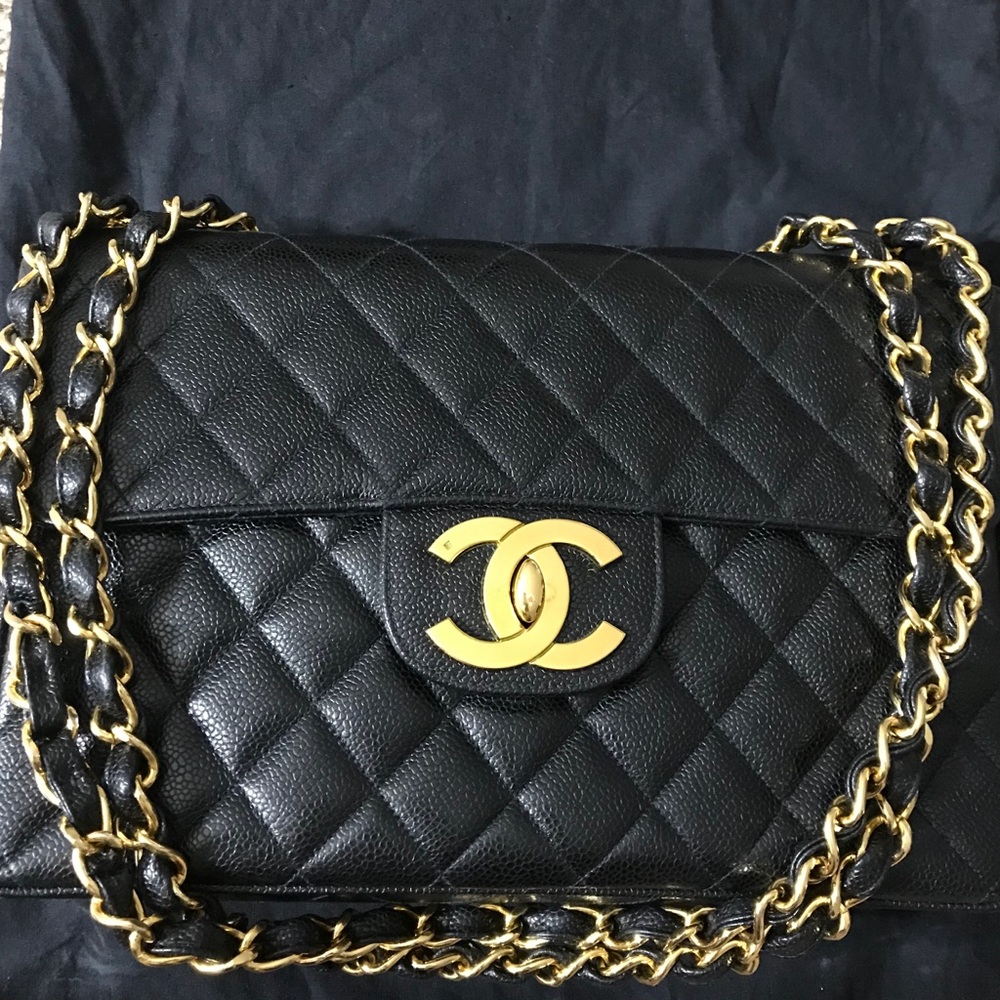 Chanel black caviar vintage classic 2.55 maxi flap